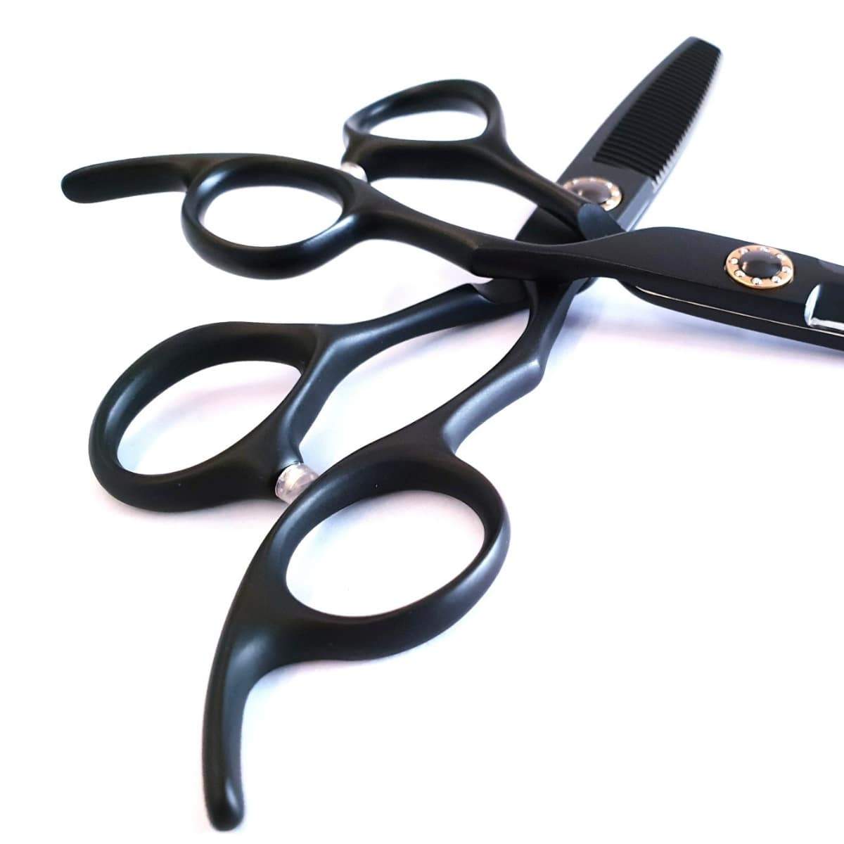 Hairdresser reaching for thinning scissors